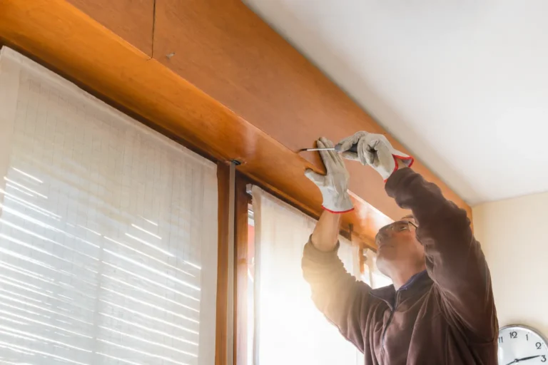 Technician repairing a commercial garage door in Canton, GA
